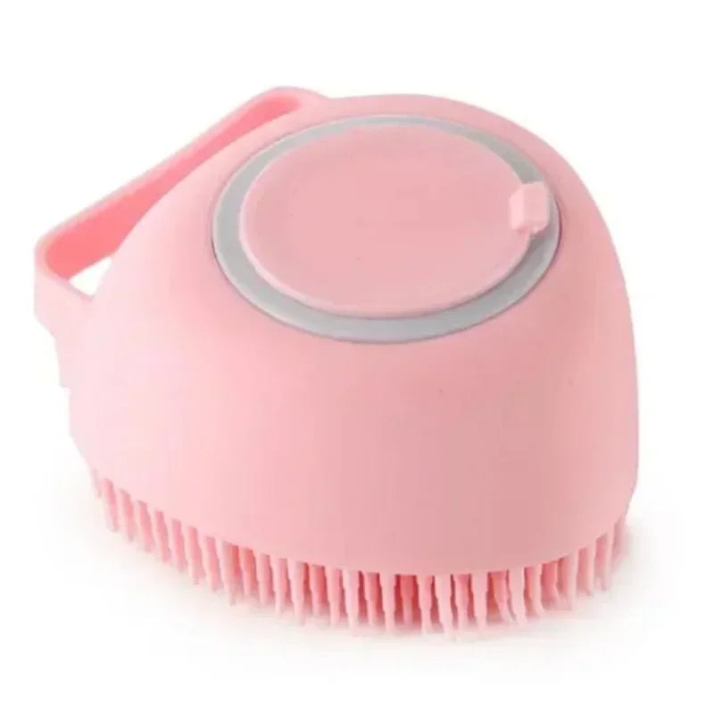 Pink silicone scrubber brush for pets with a handle on a white background