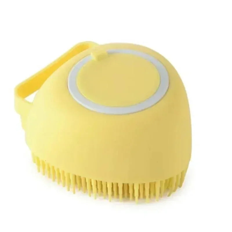 Yellow scrubber grooming brush for pets with bristles on a white background
